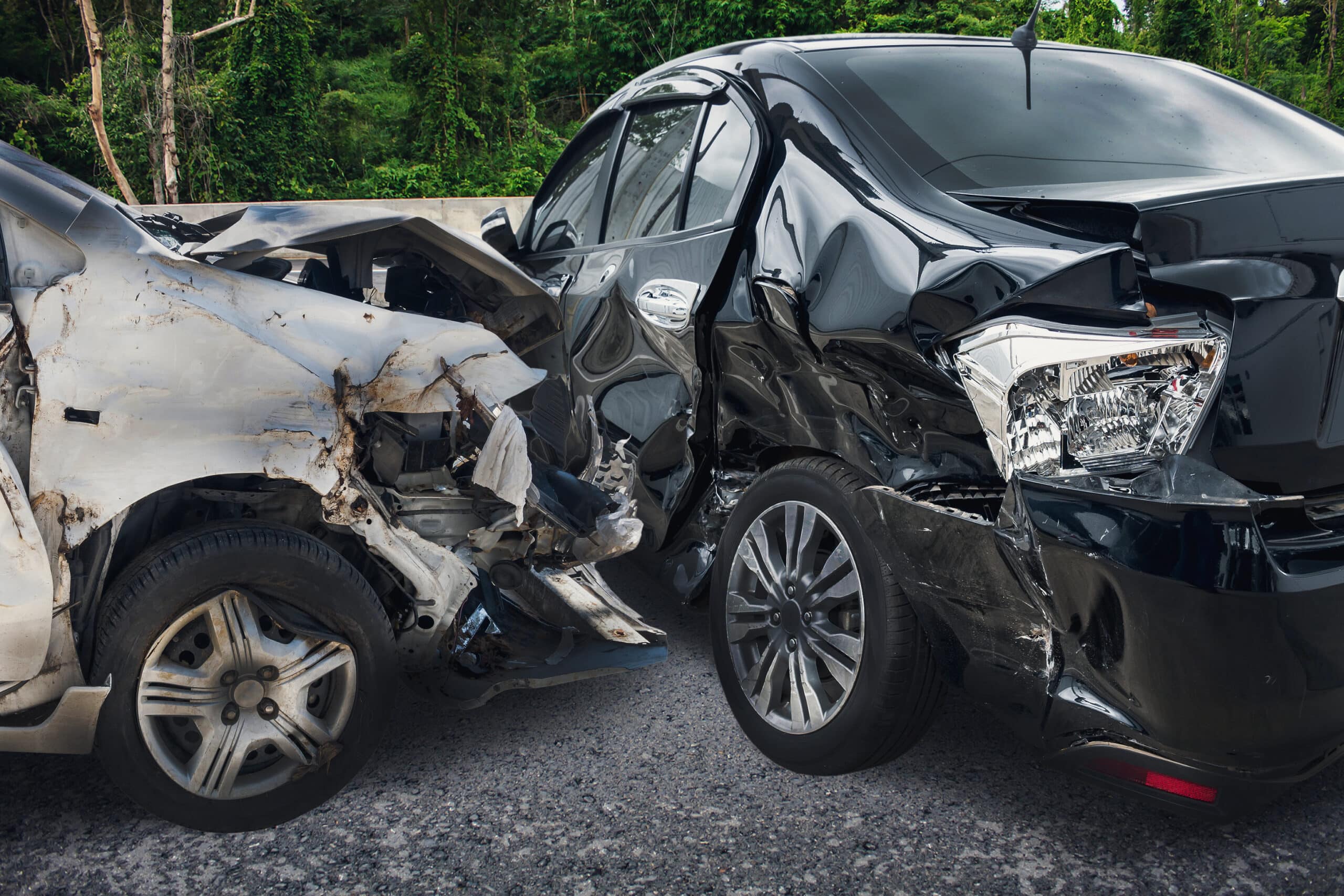 Two severely wrecked cars after a major collision