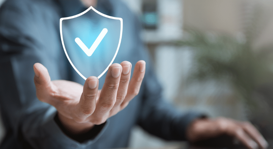 Open hand with a glowing blue protection shield and checkmark hovering above it