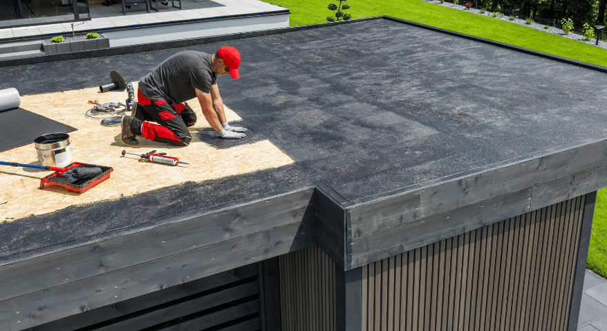 Worker making repairs on a rooftop
