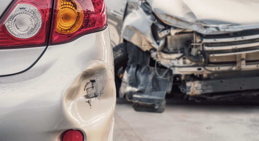Front-end collision between a maroon car and a silver car