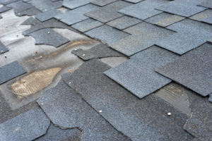 damage to residential roof shingle