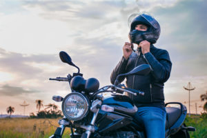 man sitting on a motorcycle