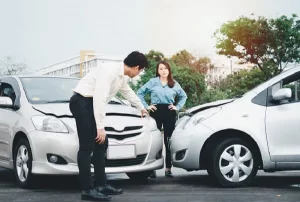 passengers reviewing damage after a car accident