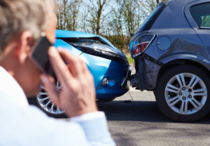 Man calling his insurance provider after an accident