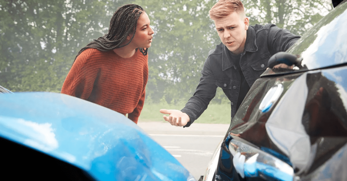 Man and woman discussing a car accident