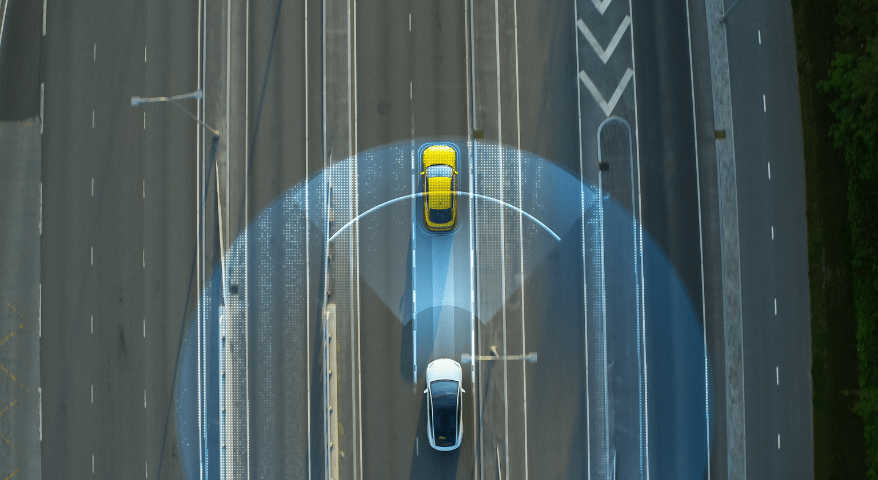 Overhead view of a car with a blue sensor zone detecting a vehicle ahead on a highway