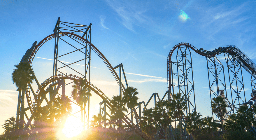 Roller coaster track against the sky at sunset at a theme park