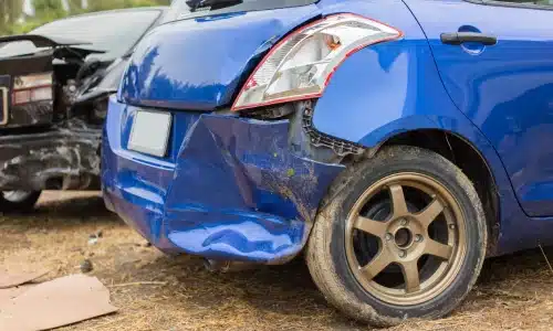 Two vehicles with damaged rear ends after one tried to back up and collided against the other.