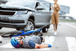 It is unclear who had the right of way in this accident between a car and a bicycle.