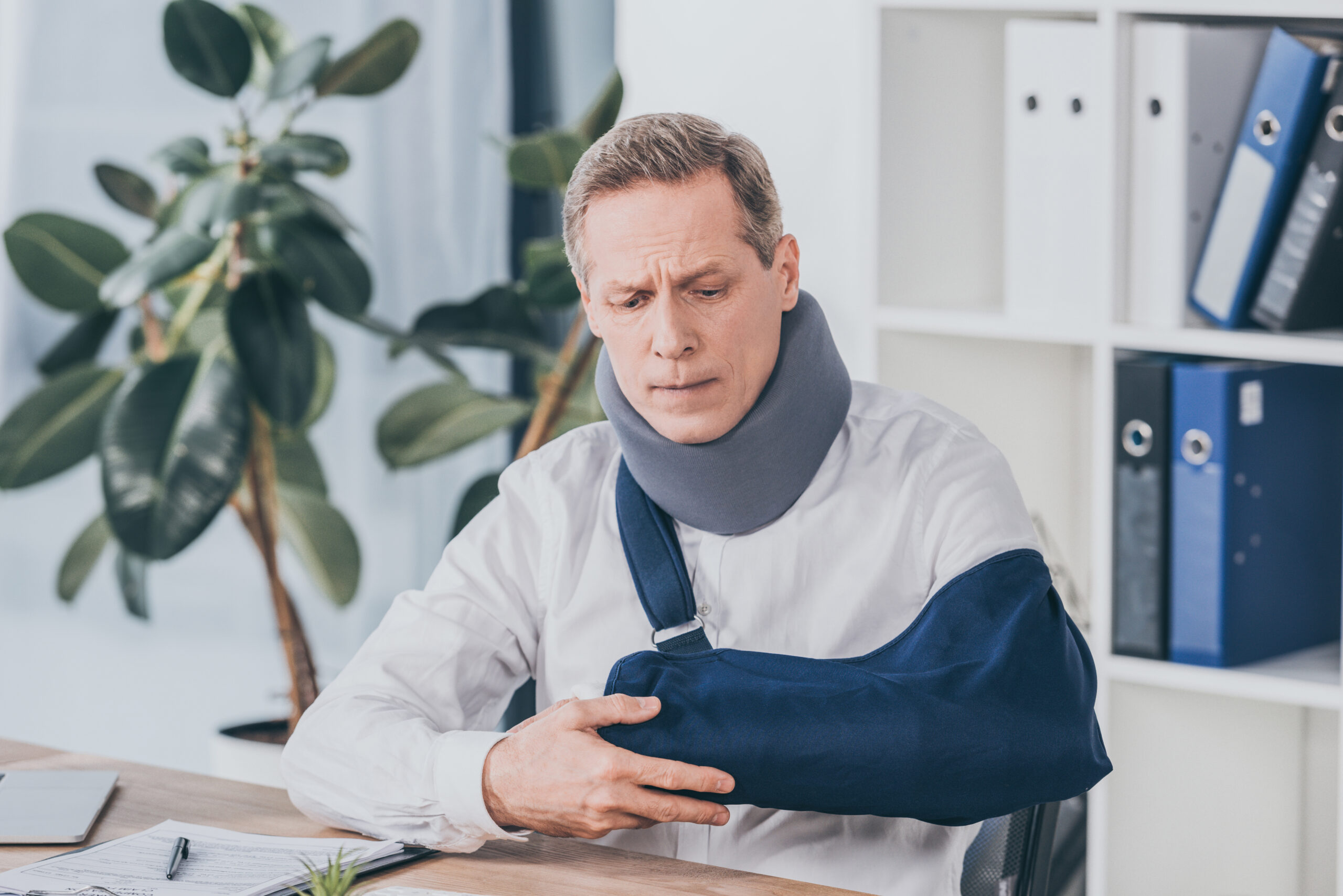 injured man sitting in an office