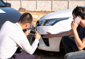 Taking pictures of a car wreck