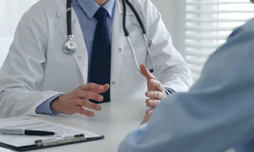 A Tampa multi-vehicle accident lawyer consults with a medical professional about the long-term care needed for his injured client’s full recovery.