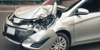 Damaged silver sedan with $1,300,000 careless driver result