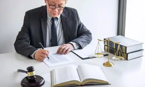 A Riverview spinal cord injury lawyer reviewing documents in preparation for a client's personal injury case.