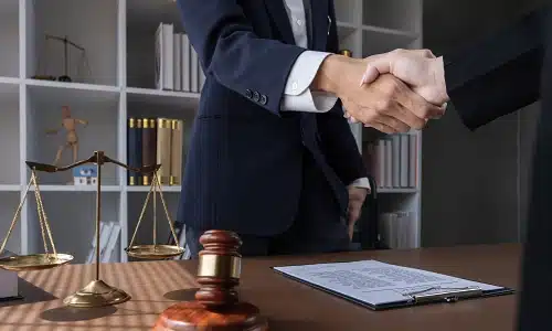 A Florida motorcycle accident lawyer shaking hands with a satisfied client
