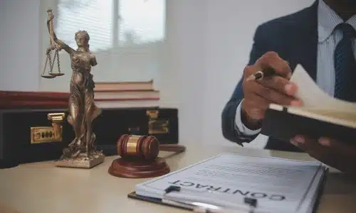 A Tampa cosmetic surgery malpractice lawyer reading through legal documents on a clipboard