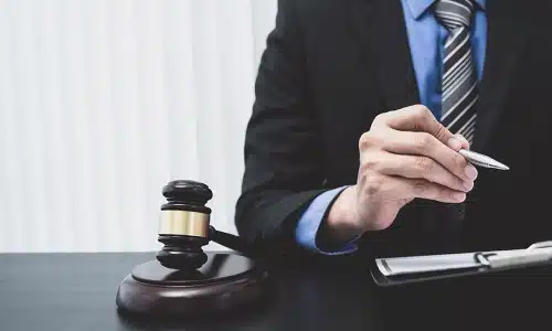 A Tampa golf cart accident lawyer reading through case files on a clipboard