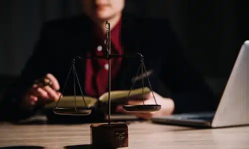 A medical malpractice lawyer serving Tampa sits in an office while reading a law book