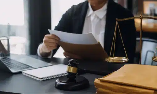A Tampa misdiagnosis lawyer opening an envelope with case files inside