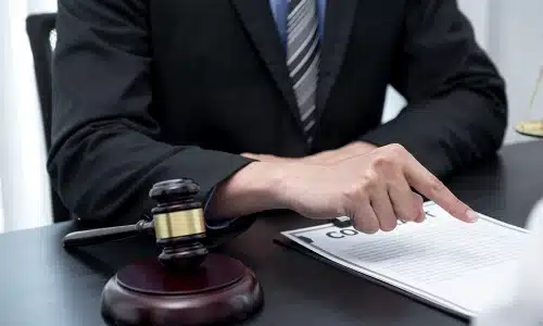 A Tampa product liability lawyer going over the details of a contract with a client