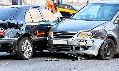 A photo of two cars damaged after a side-impact collision.