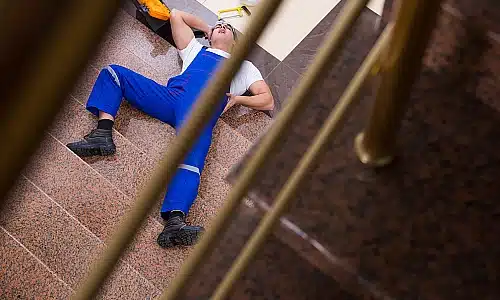 A photo of an injured man who fell on a stairway.